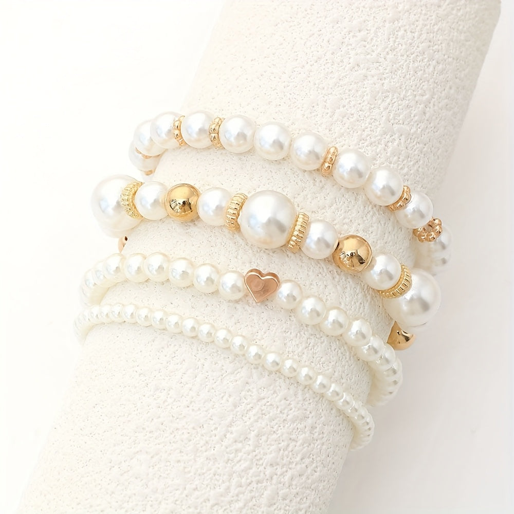Conjunto de elegantes pulseras en forma de corazón con perlas